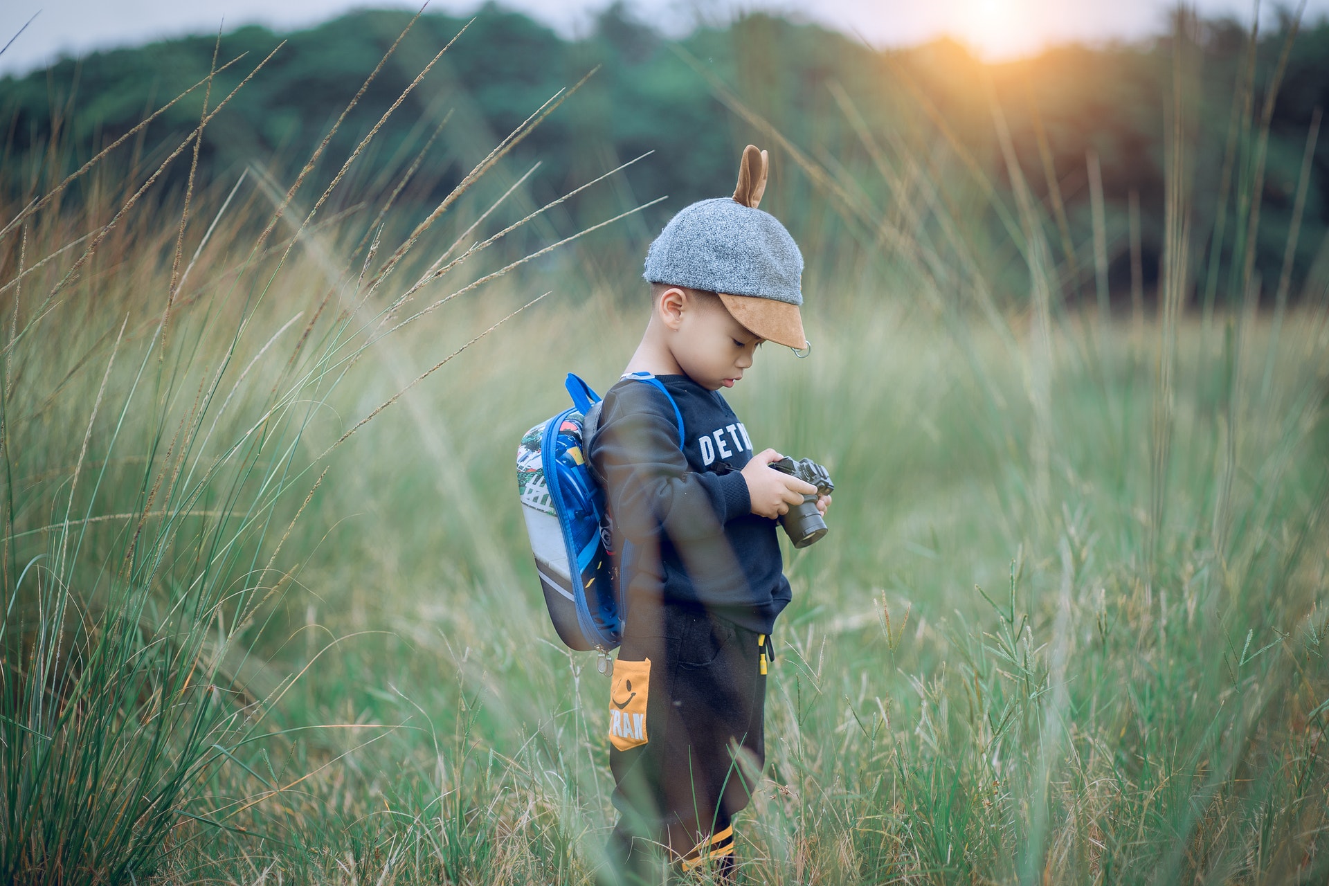 toddler-holding-camera-1549974